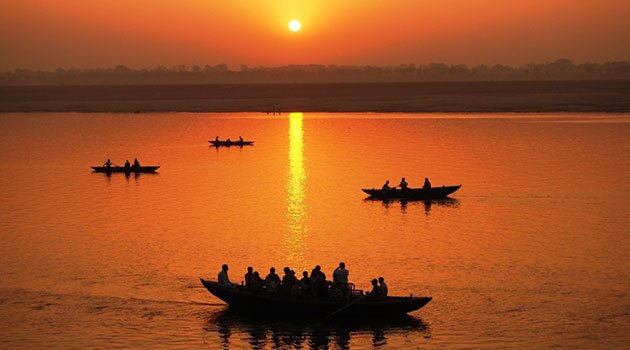 Take a sunrise boat ride along the holy Ganga river